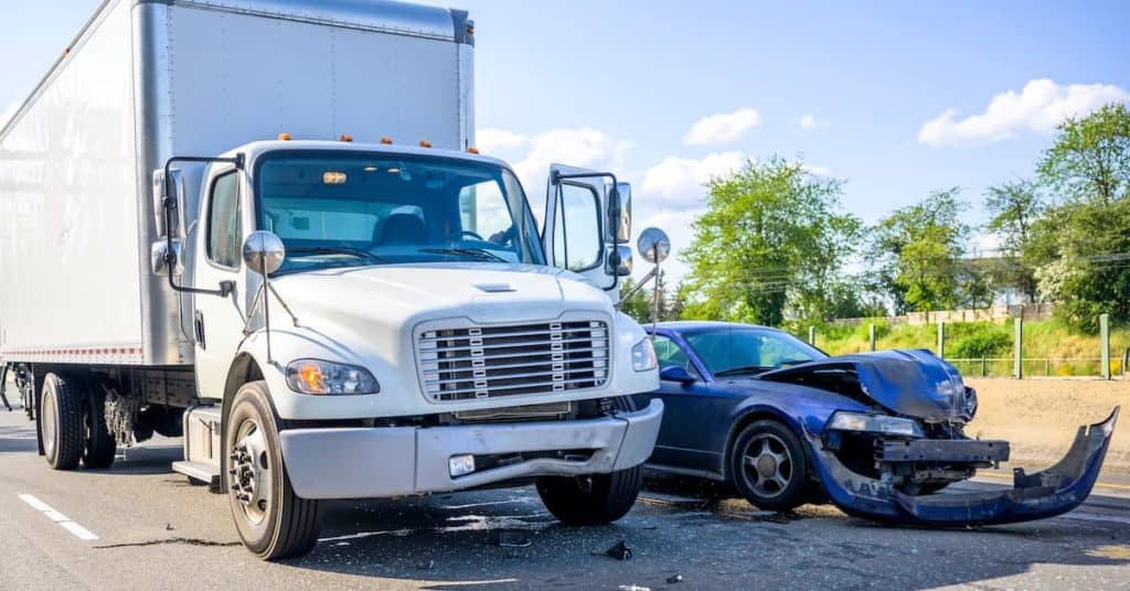 A truck and a car crash - The Bishop Law Group