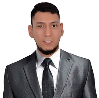 Diego Forero Cardona, an experienced Legal Assistant, confidently poses for a photo in a suit and tie. - The Bishop Law Group